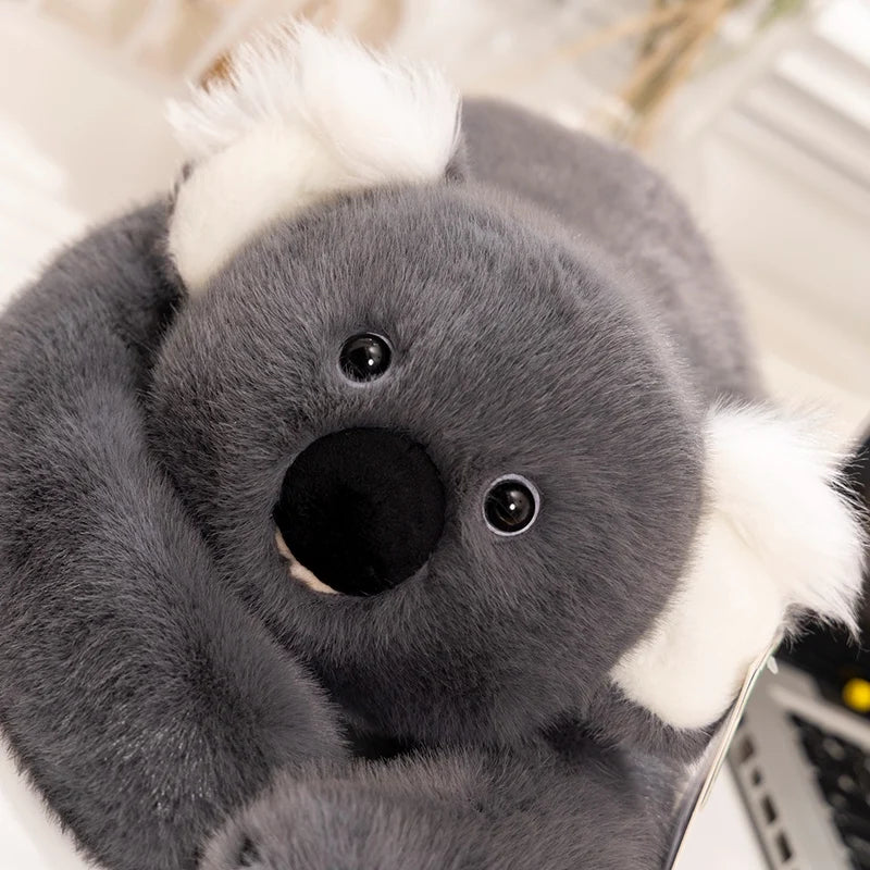 Adorable gray koala stuffed animal with soft fur, resting on table