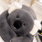 Adorable gray koala stuffed animal with soft fur, resting on table