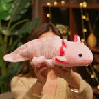 Large pink axolotl plush toy held up for display, highlighting its long body and soft stuffed design.
